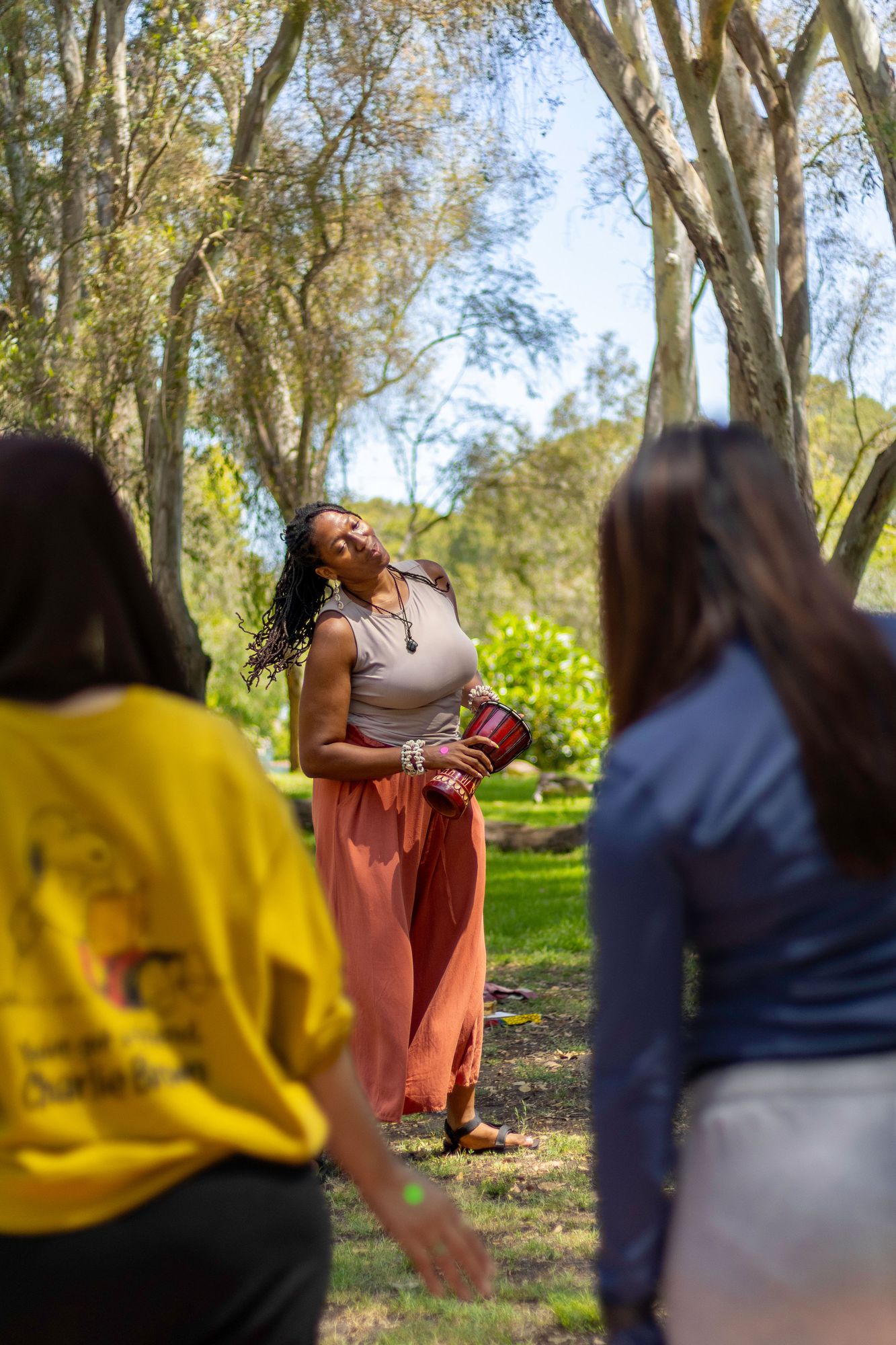 Nnemoma Chukwumerije leading a breathwork session outdoors